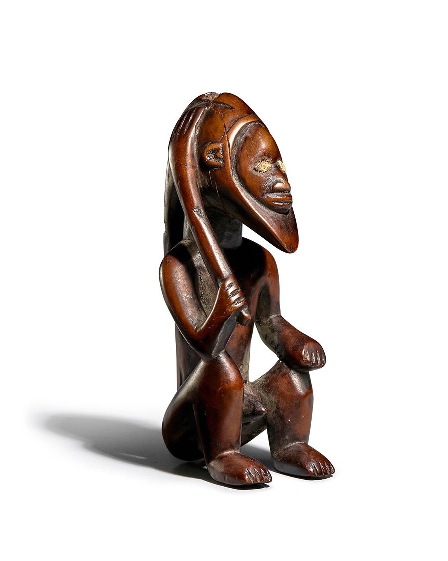 Lot 131. Fine Bembe Seated Figure, mukua, Democratic Republic of the Congo. Estimate: $30,000 - $40,000