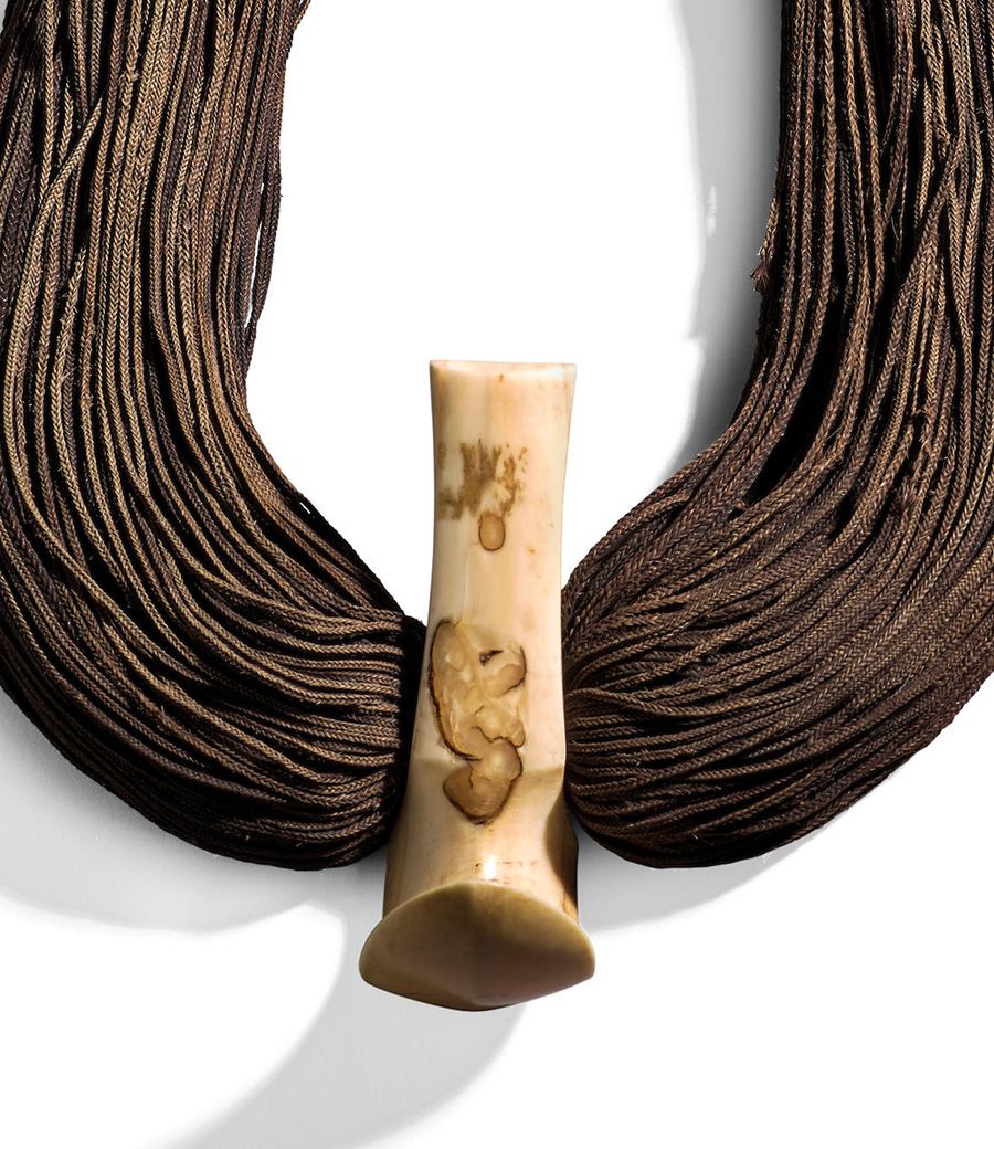 Lot 28. Important Hook Pendant Necklace, lei niho palaoa, Hawaiian Islands. Estimate: $70,000 - $90,000
