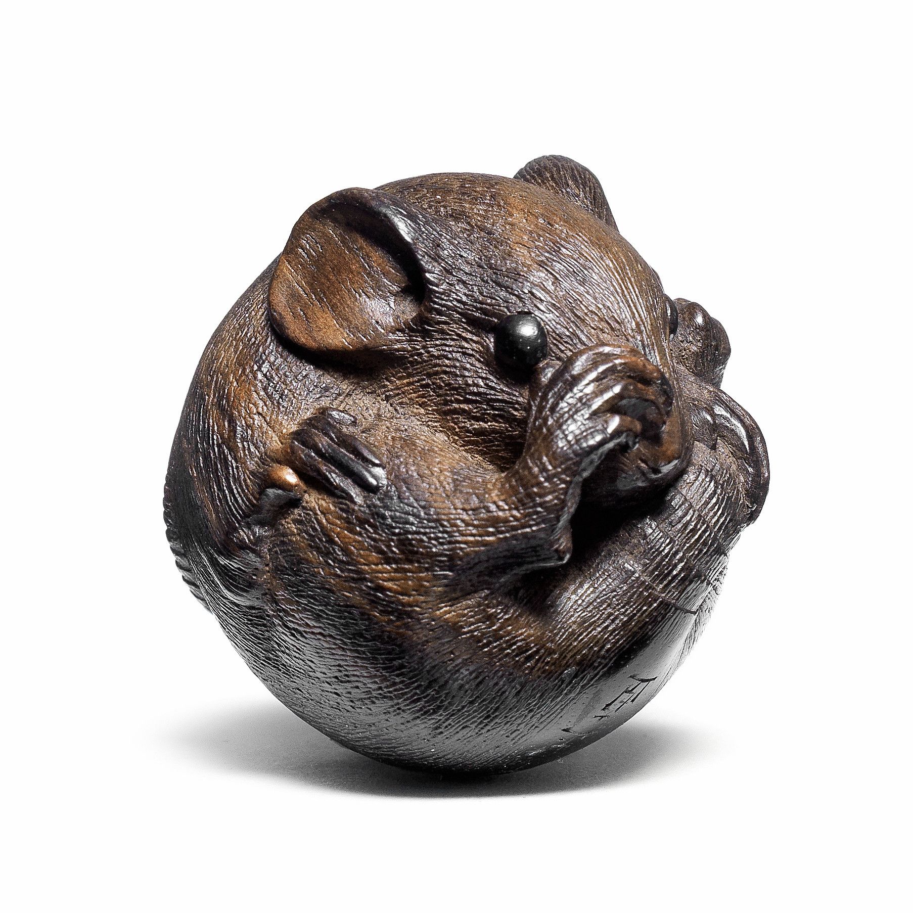 Bonhams : A kurogaki (black persimmon) wood netsuke of a coiled rat By  Masanao, Ise, 19th century