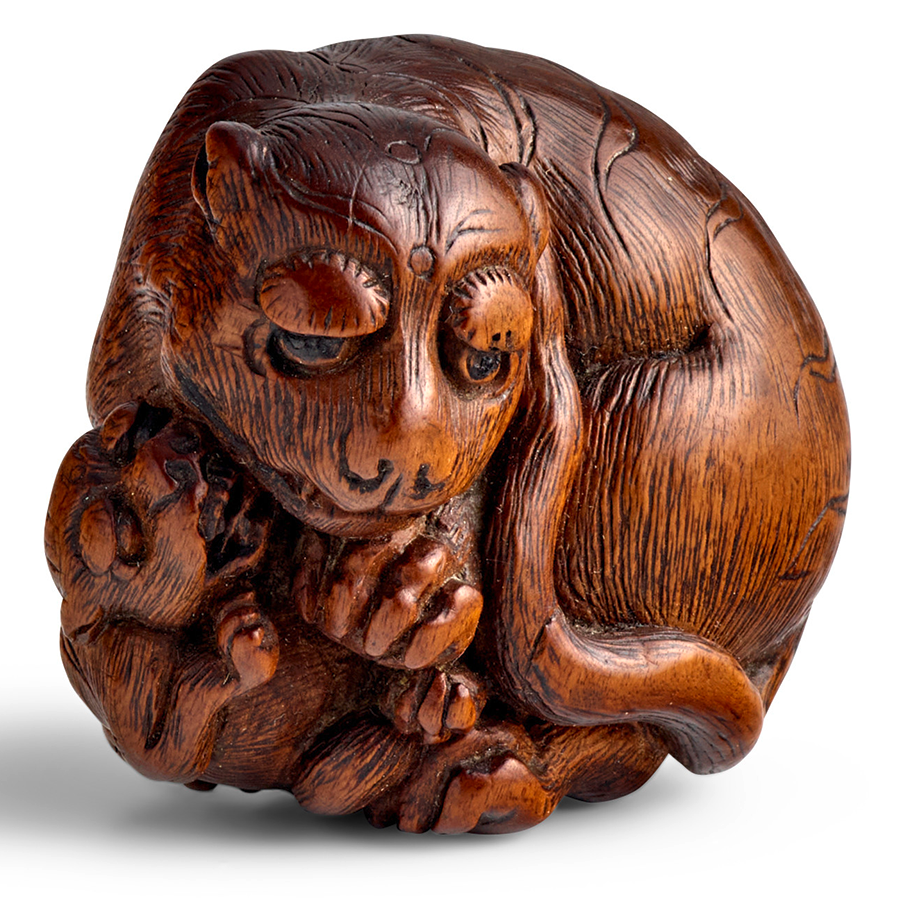 A large wood netsuke of a tiger and cub, signed Tametaka. Estimate: $10,000 - $15,000