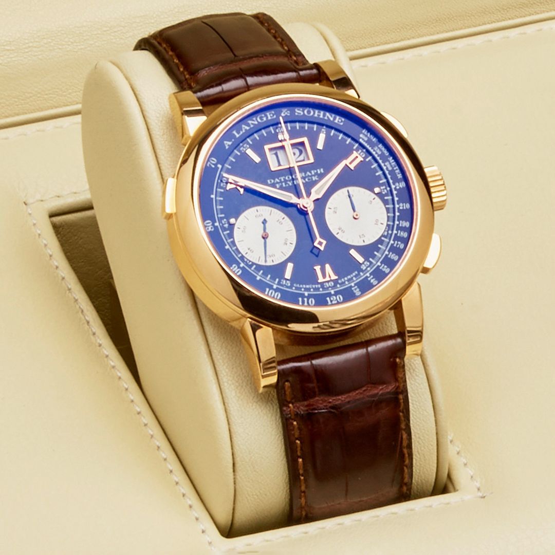 Lot 65. A. Lange & Söhne. A Fine 18K Rose Gold Flyback Chronograph Wristwatch with Date. Sold for $56,562.