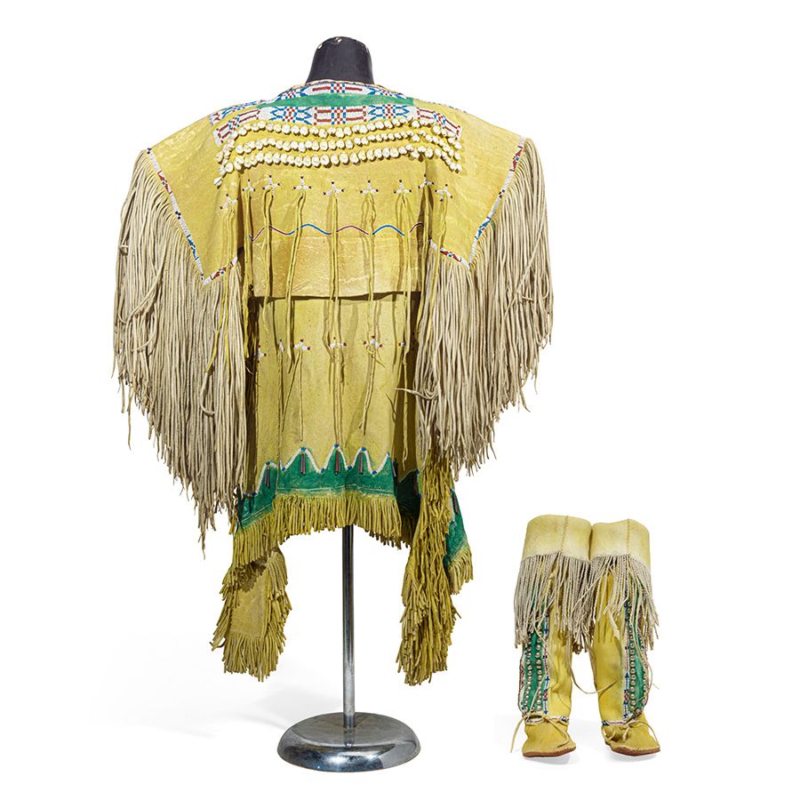 Lot 316. A Cáuigú/Ka'igwu (Kiowa) young girl's beaded dress and hightop moccasins. Estimate: $15,000 - $25,000