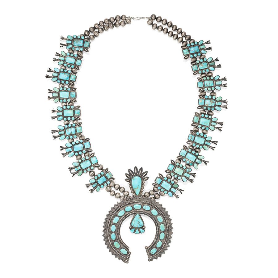 Lot 11. An exceptionally large Zuni squash blossom necklace. Estimate: $2,000 - $3,000