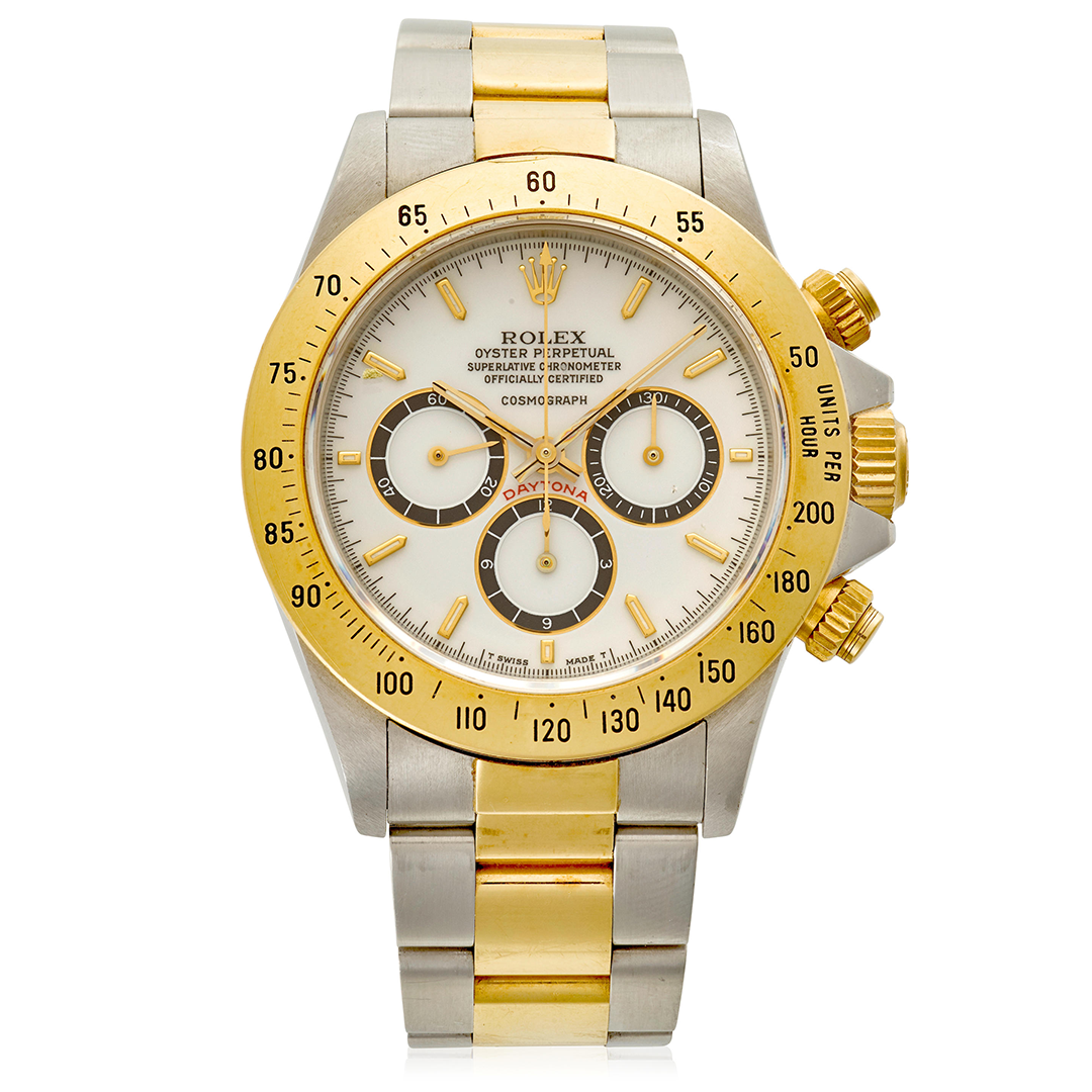 Lot 5. Rolex. A Rare 18k Gold and Stainless-steel Automatic Chronograph Bracelet Watch With 'Porcelain Floating Dial' and Zenith Movement. Estimate: $20,000-40,000